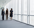Businesswomen Walking in Hallway