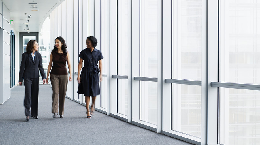 Businesswomen Walking in Hallway