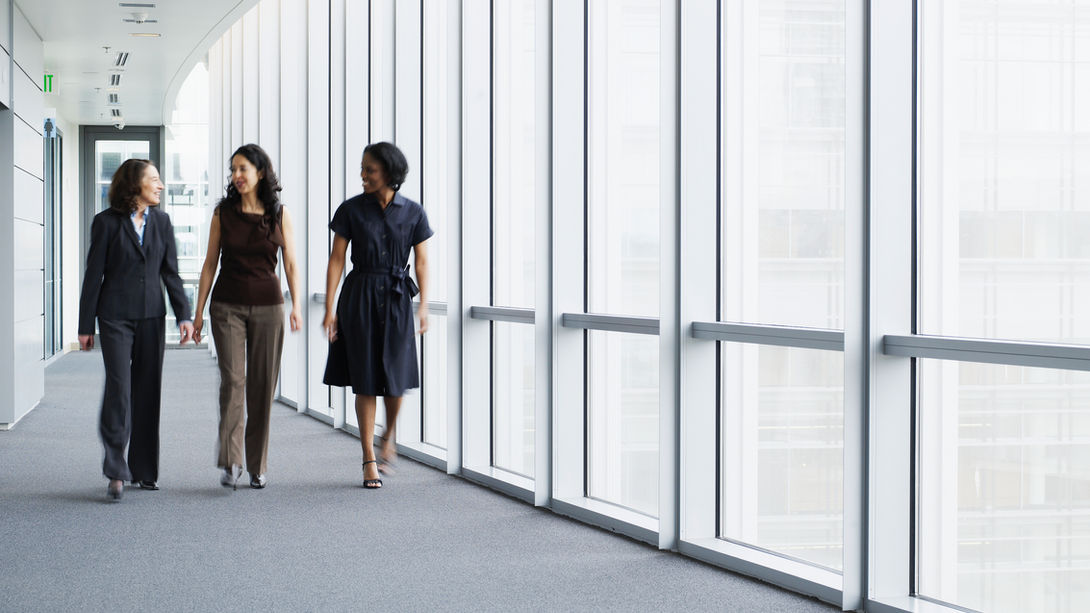 Businesswomen Walking in Hallway