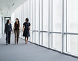 Businesswomen Walking in Hallway