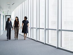 Businesswomen Walking in Hallway