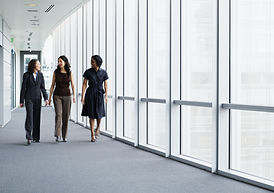 Businesswomen Walking in Hallway