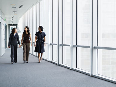 Businesswomen Walking in Hallway
