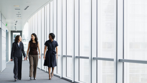 Businesswomen Walking in Hallway