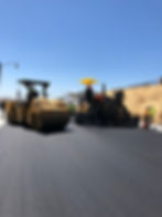 Roller and Paver, resurfacing a new roadway with operators at the helm