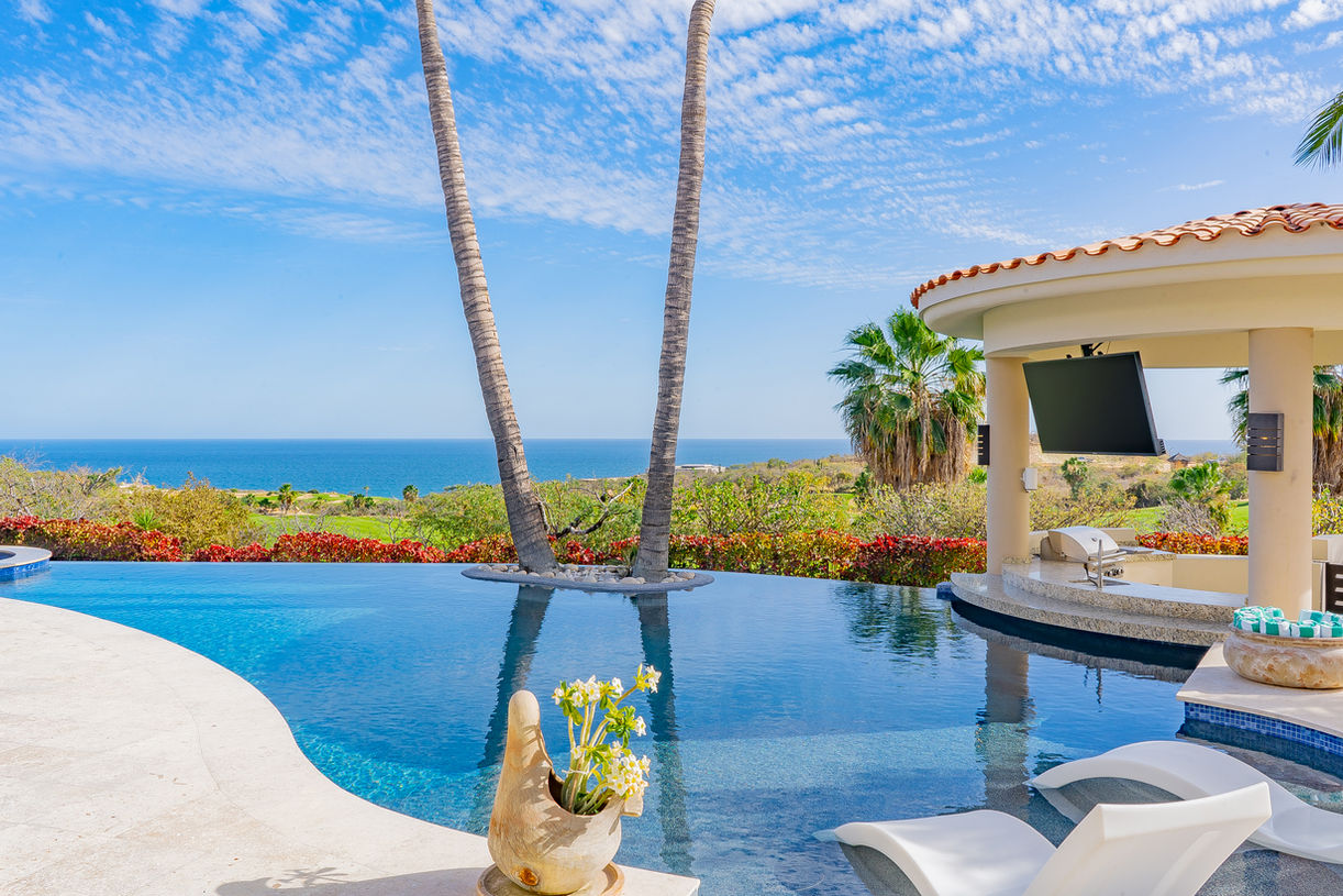 Infinity pool with baja shelf and ocean views at Casa Kokomo Cabo