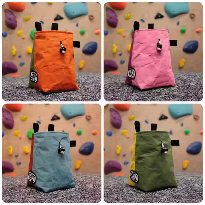 Thumbnail: 4 unique and stylish chalk bags made from different combinations of bright wax canvas, set against a climbing wall