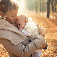 Mother and baby in autumn