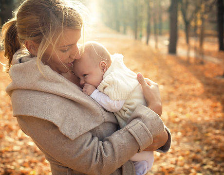 Mother and baby in autumn