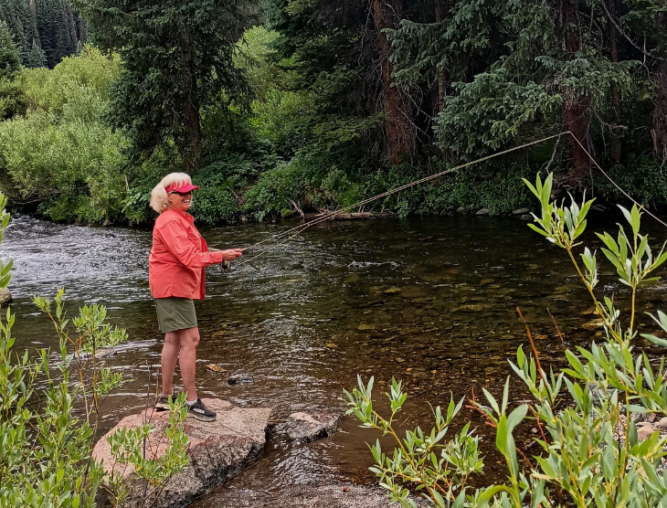 woman fly fishing in the river