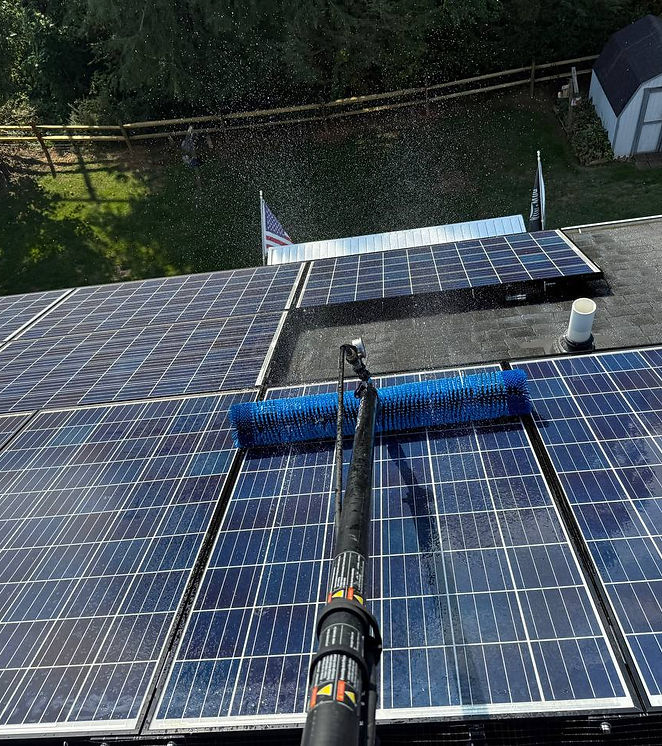 Close-up of solar panel surface during professional cleaning with pure water.