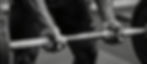 Close-up of muscular hands gripping a barbell for a deadlift