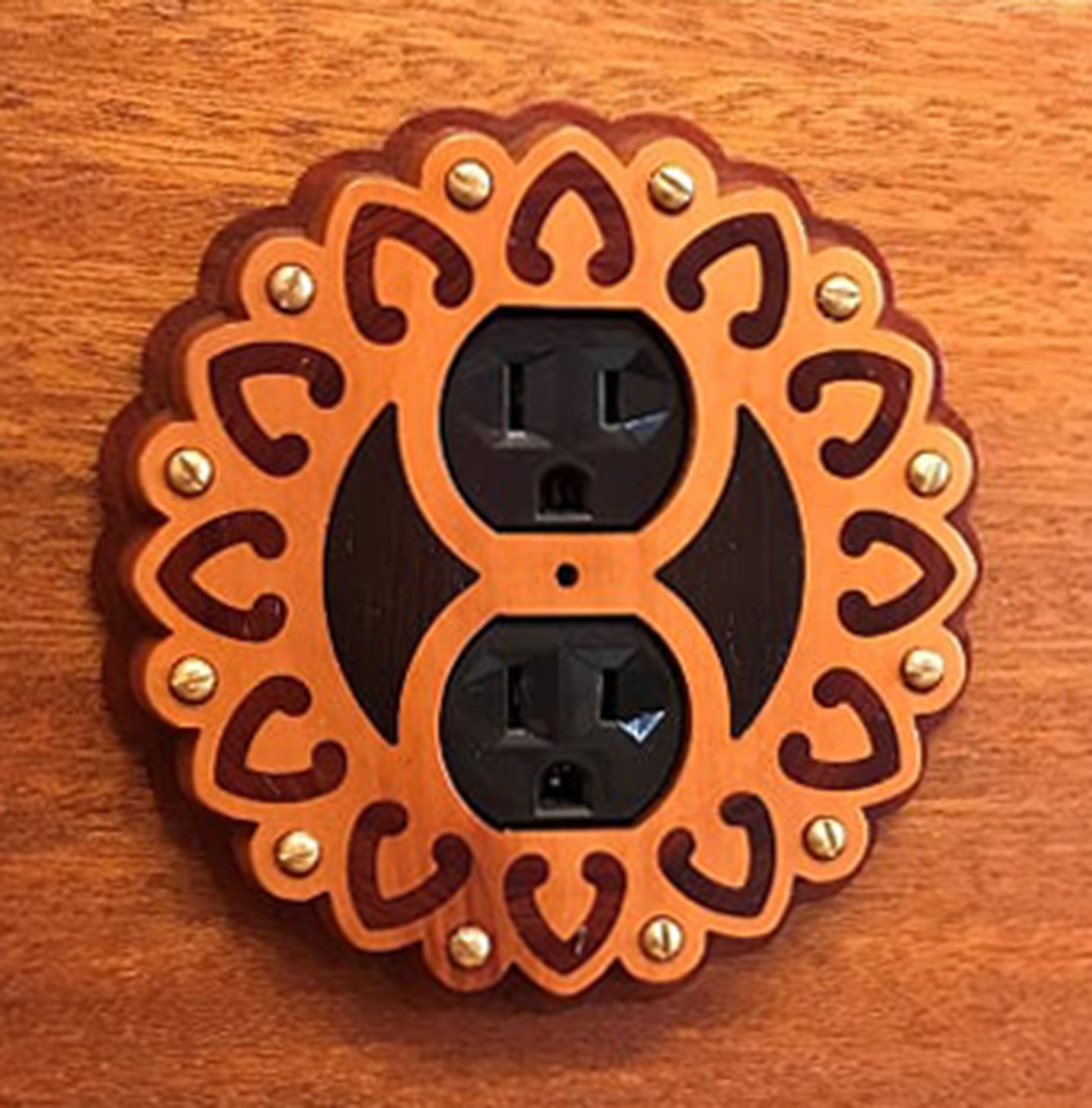 Outlet cover inspired by sconce