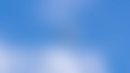 Diamond Da40 flying against a bright blue sky with scattered clouds, viewed from below. The scene feels serene and open.