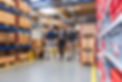 three-men-walking-and-talking-in-factory-storeroom-2022-12-16-22-18-39-utc.jpg