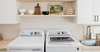 Washer repair Calgary - Red Seal certified technician servicing a front load washing machi
