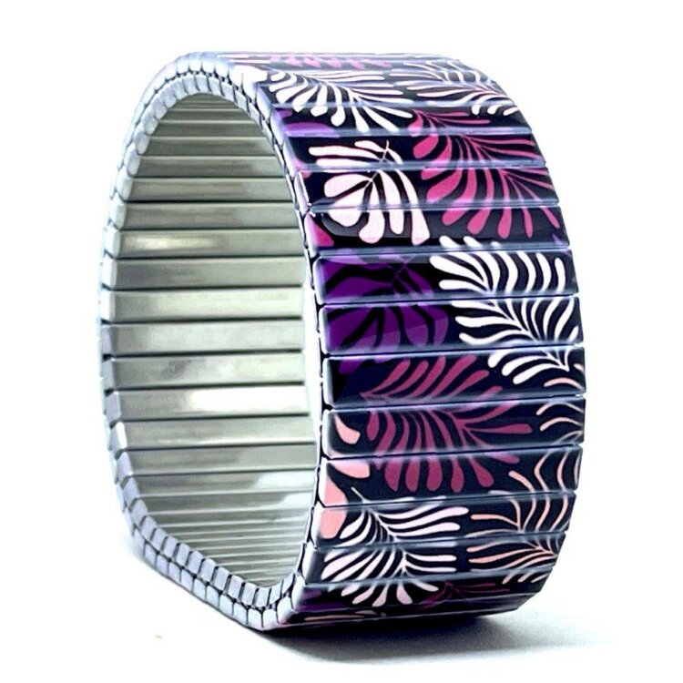 A bold 22mm stainless steel stretch bracelet featuring the Cool Blossom English garden design in a polished finish. The wide profile gives the artwork maximum impact, while the clasp-free construction makes it easy and comfortable to wear. by Urband London