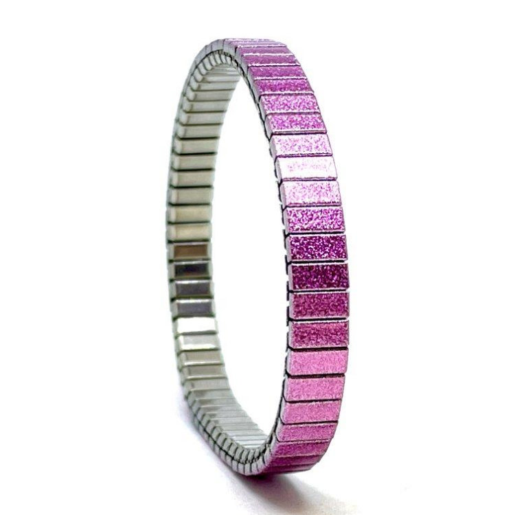A slim 6mm stainless steel stretch bracelet featuring the Solo pink ribbon design in a metallic finish. The clasp-free construction slips easily over the wrist for comfortable everyday wear.  by Urband London