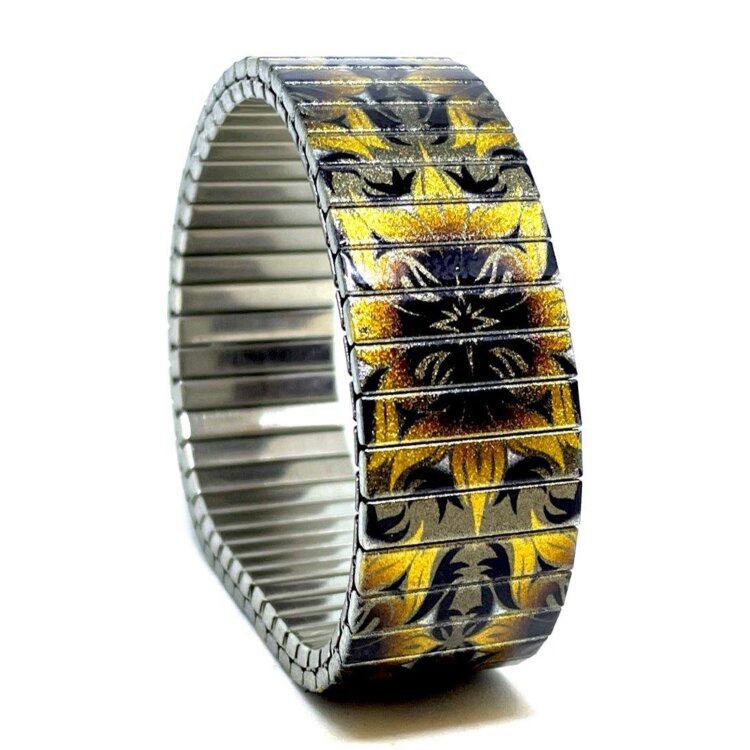 18mm stainless steel stretch bracelet featuring the Flowers Cross earthy obsession artwork in a metallic finish. Clasp-free, waterproof, scratch-resistant and nickel-free. Handmade in London and supplied in a gift box. by Urband London