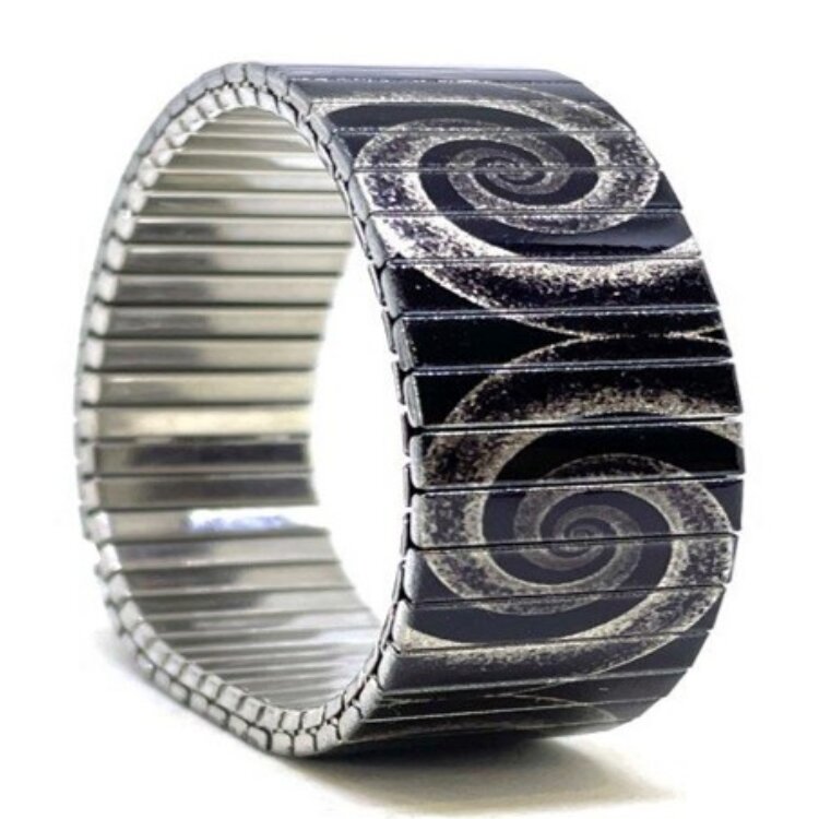 A bold 22mm stainless steel stretch bracelet featuring the Circles Eclipse grey elephant design in a metallic finish. The wide profile gives the artwork maximum impact, while the clasp-free construction makes it easy and comfortable to wear. Waterproof, scratch-resistant and nickel-free, each bracelet is handmade in London and presented in a gift box. by Urband London
