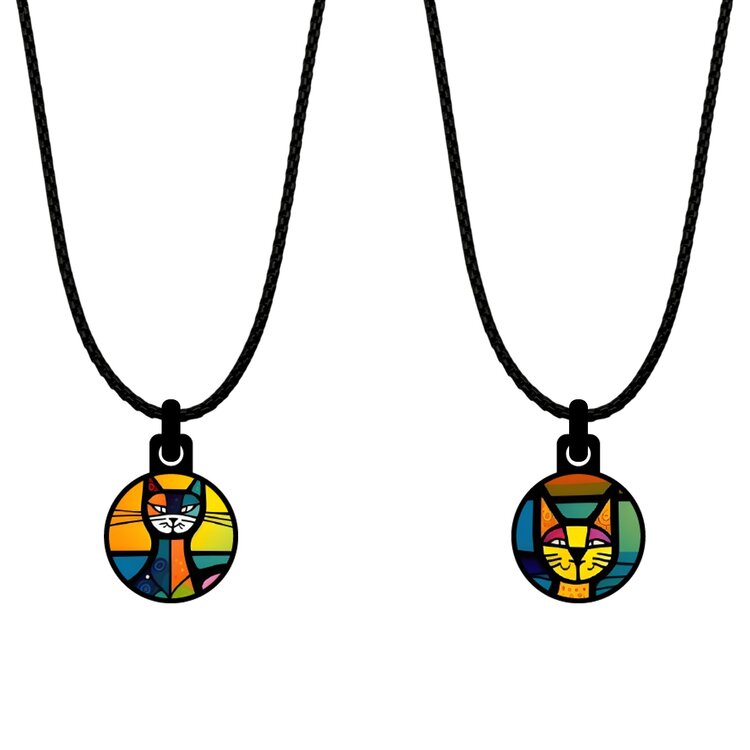 A double-sided 14mm round stainless steel pendant featuring the Art cats paradise design in a metallic finish. The artwork is visible on both sides, giving the pendant a distinctive look from every angle. by Urband London