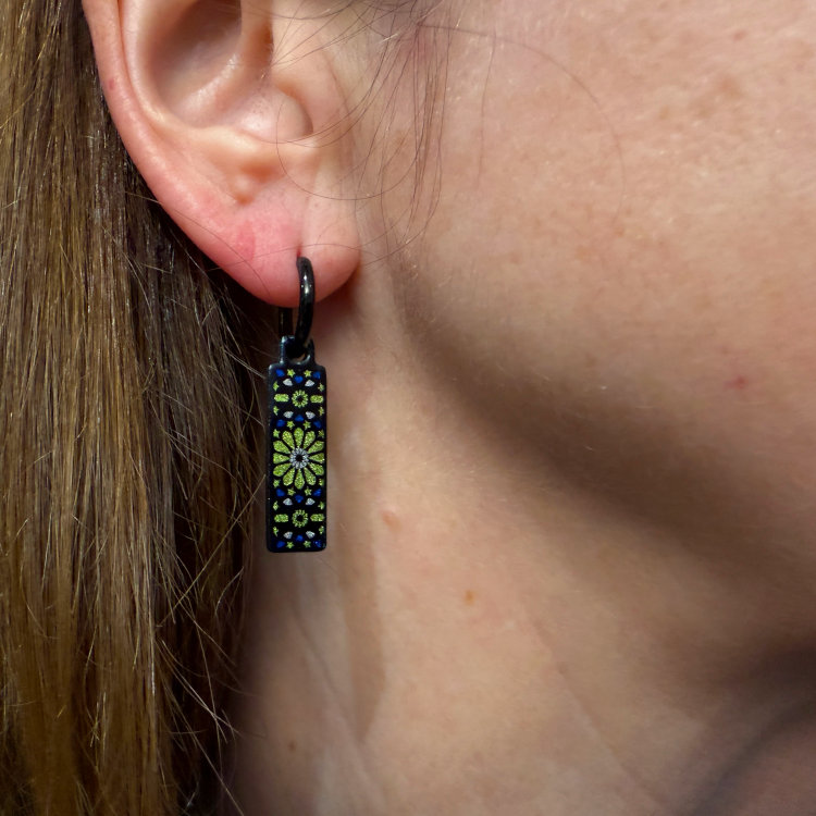 Double-sided 8mm x 24mm rectangular stainless steel drop earrings featuring the Carnival mojito design in a metallic finish. The slim double-sided drops show the artwork from either side and create a clean, contemporary look. by Urband London