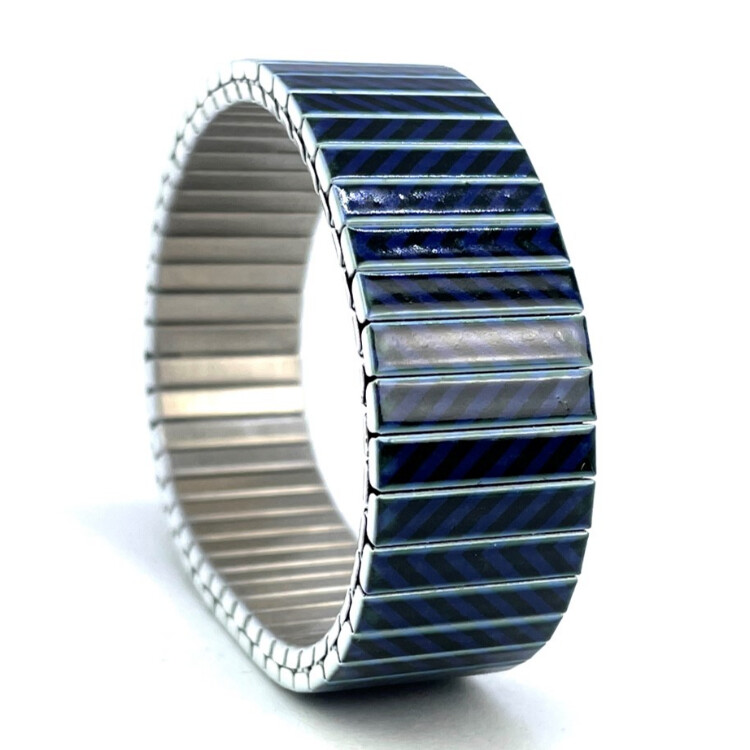 18mm stainless steel stretch bracelet featuring the Zigzag black blue artwork in a polished finish. Clasp-free, waterproof, scratch-resistant and nickel-free. Handmade in London and supplied in a gift box. by Urband London