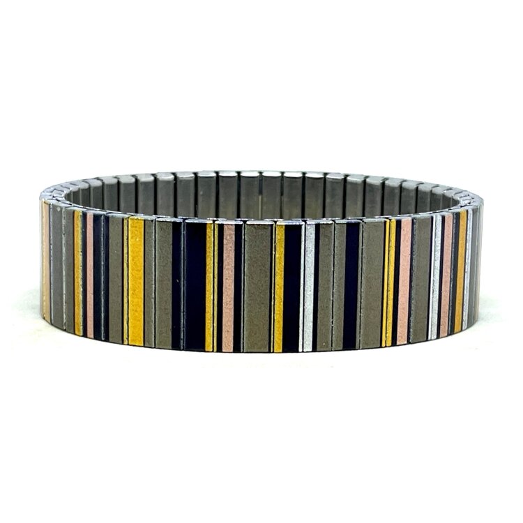 A statement 18mm stainless steel stretch bracelet featuring the Lines Art golden beads design in a metallic finish. The wider profile gives the artwork extra impact, while the clasp-free construction makes it easy and comfortable to wear. by Urband London