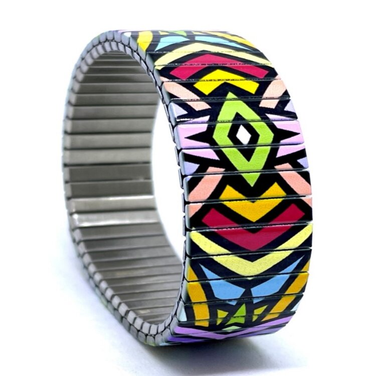 A bold 22mm stainless steel stretch bracelet featuring the Circles Mandala rio design in a metallic finish. The wide profile gives the artwork maximum impact, while the clasp-free construction makes it easy and comfortable to wear. by Urband London