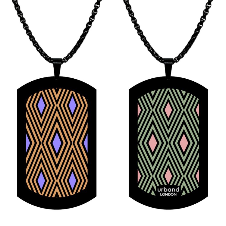 A double-sided 29mm x 50mm stainless steel pendant featuring the Lisbon Squares earthy Figueira design in a metallic finish. The larger format gives the two-sided artwork strong visual impact from every angle. Waterproof, scratch-resistant and nickel-free, it is handmade in London and presented in a gift box. by Urband London