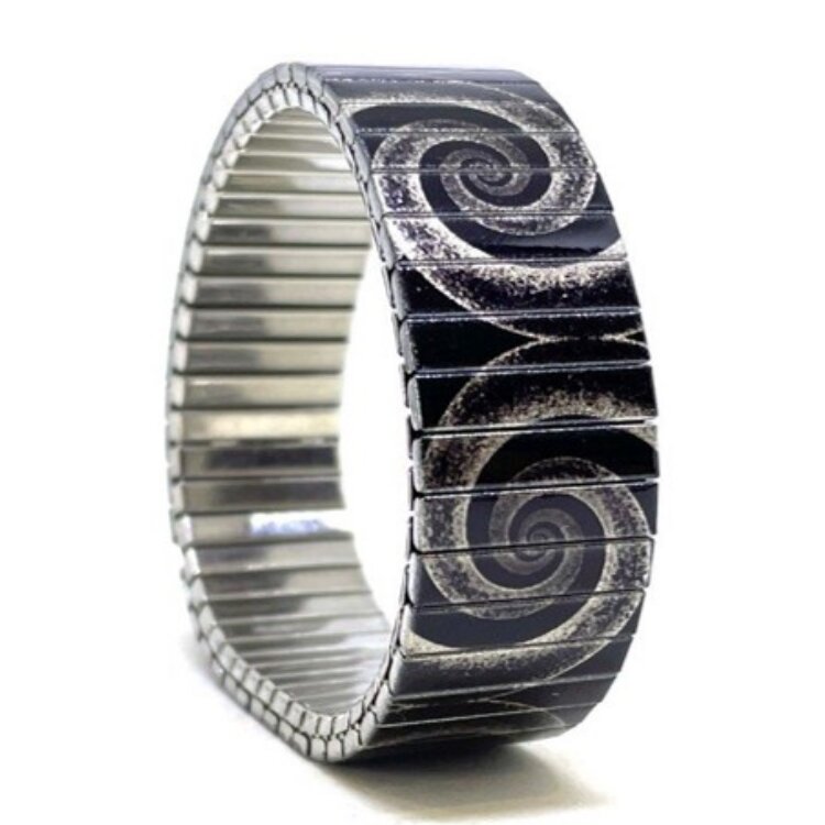 18mm stainless steel stretch bracelet featuring the Circles Eclipse grey elephant artwork in a metallic finish. Clasp-free, waterproof, scratch-resistant and nickel-free. Handmade in London and supplied in a gift box. by Urband London