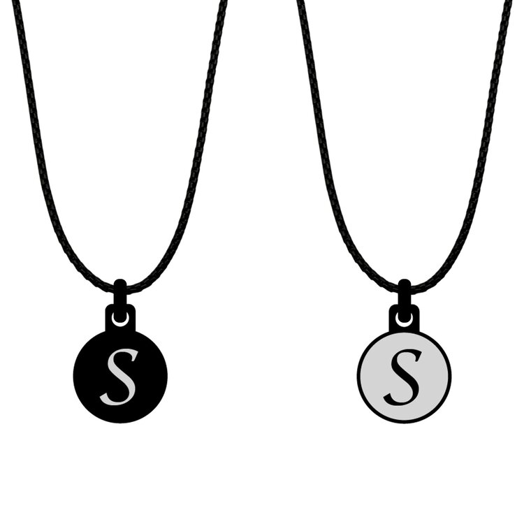 A double-sided 14mm round stainless steel pendant featuring the Initial S black and silver design in a metallic finish. The artwork is visible on both sides, giving the pendant a distinctive look from every angle.  by Urband London