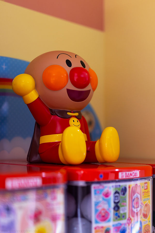 Japanese mascot adorns a gacha machine