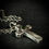 Thumbnail: Handmade silver hollow cross necklace with green tourmaline
