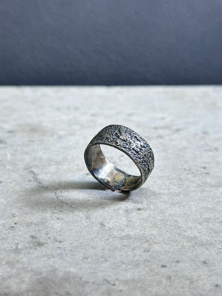 Handmade silver ring with silver dust texture