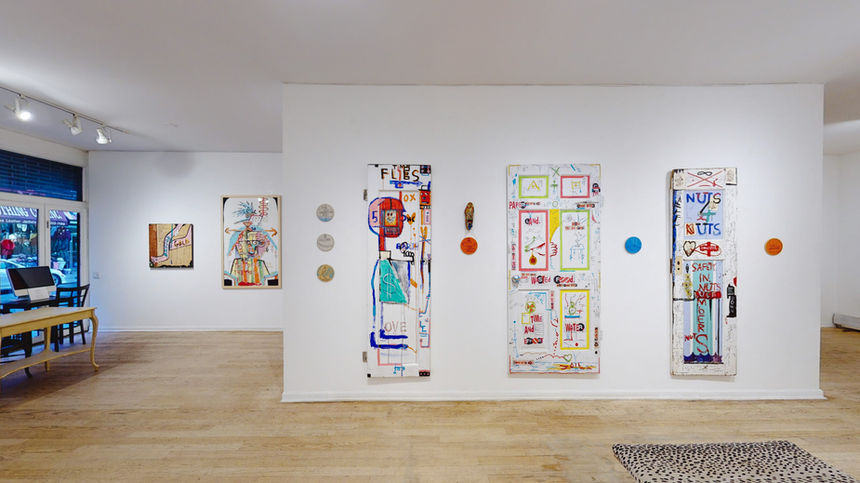 Installation by Jason McLean documenting his characteristic drawing style, with layered paper works and expressive mark-making forming an immersive, chaotic visual field.
