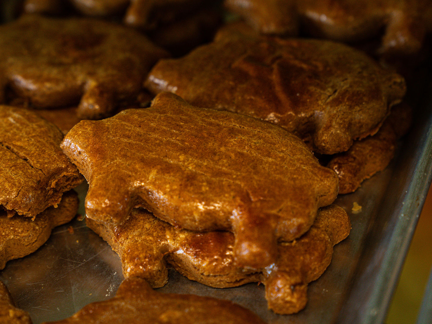 Classic Marranito Gingerbread Pan Dulce stacked on tray in bakery