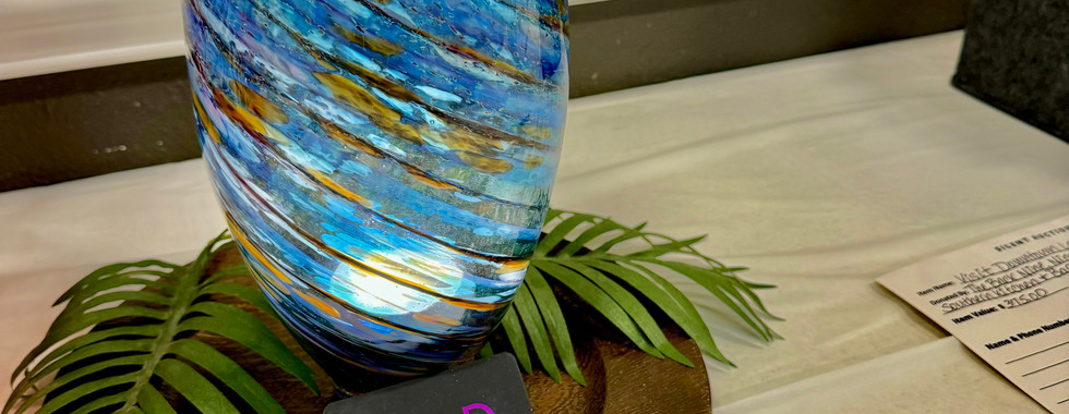 Hand-blown glass art pieces available for bidding at the silent auction, offering unique and beautiful items at Sheryl's BreastFest.