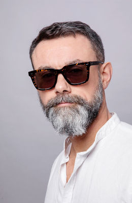 Male model wearing luxury sunglasses in eyewear fashion photography by Simon Clemenger