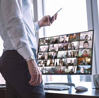 shutterstock_1744238483.jpg Legal professional facilitating a large virtual continuing education session with participants on