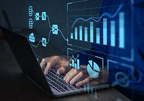 Analyst working with Business Analytics and Data Management System on computer to make rep