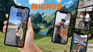 Werbegrafik für Migros mit Schweizer Berglandschaft im Hintergrund und mehreren Smartphone-Screens mit Social-Media-Reels von Influencerinnen und Influencern aus verschiedenen Sprachregionen der Schweiz. Zu sehen sind Strassenumfragen, Interviews vor Migros-Filialen sowie Inhalte rund um regionale Produkte und Schweizer Dialekte. Eine Hand hält ein Smartphone mit einer Content Creatorin vor einem Ortsschild. Im Zentrum steht das Migros-Logo. Fokus auf Regionalität, Social Media, Influencer-Marketing und Schweizer Identität.