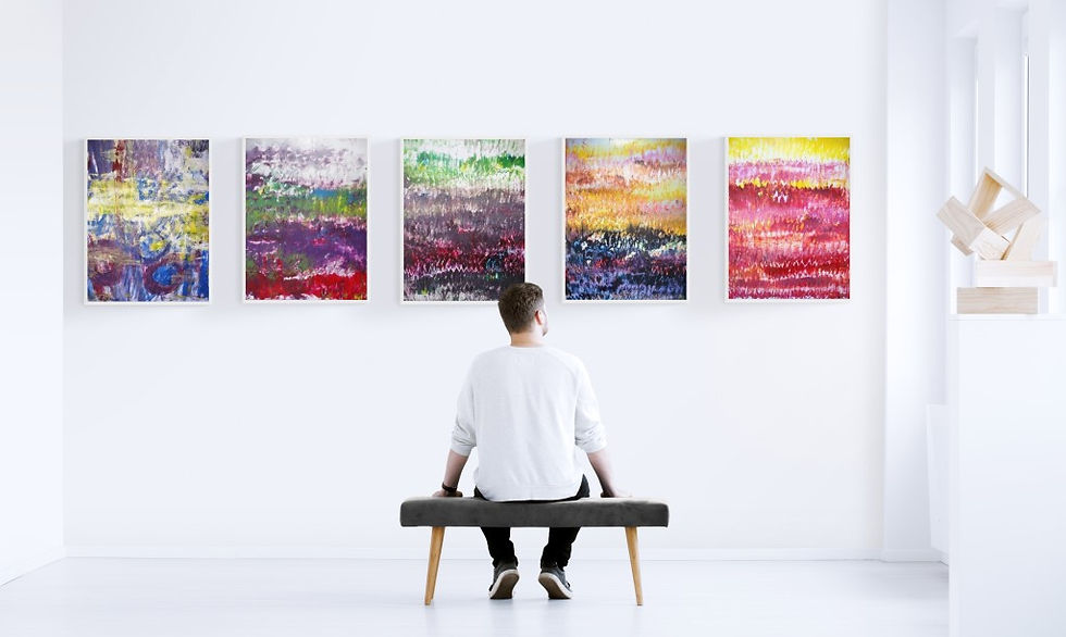 Eye-level view of an investor observing a contemporary painting in a gallery