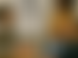 A diverse group of five professionals gathered in a modern conference room. The Black female leader stands near a whiteboard titled “When Inclusion Sparks Disagreement.” She smiles while a white male speaks. An Asian male and white female look at the white male with concerned faces.