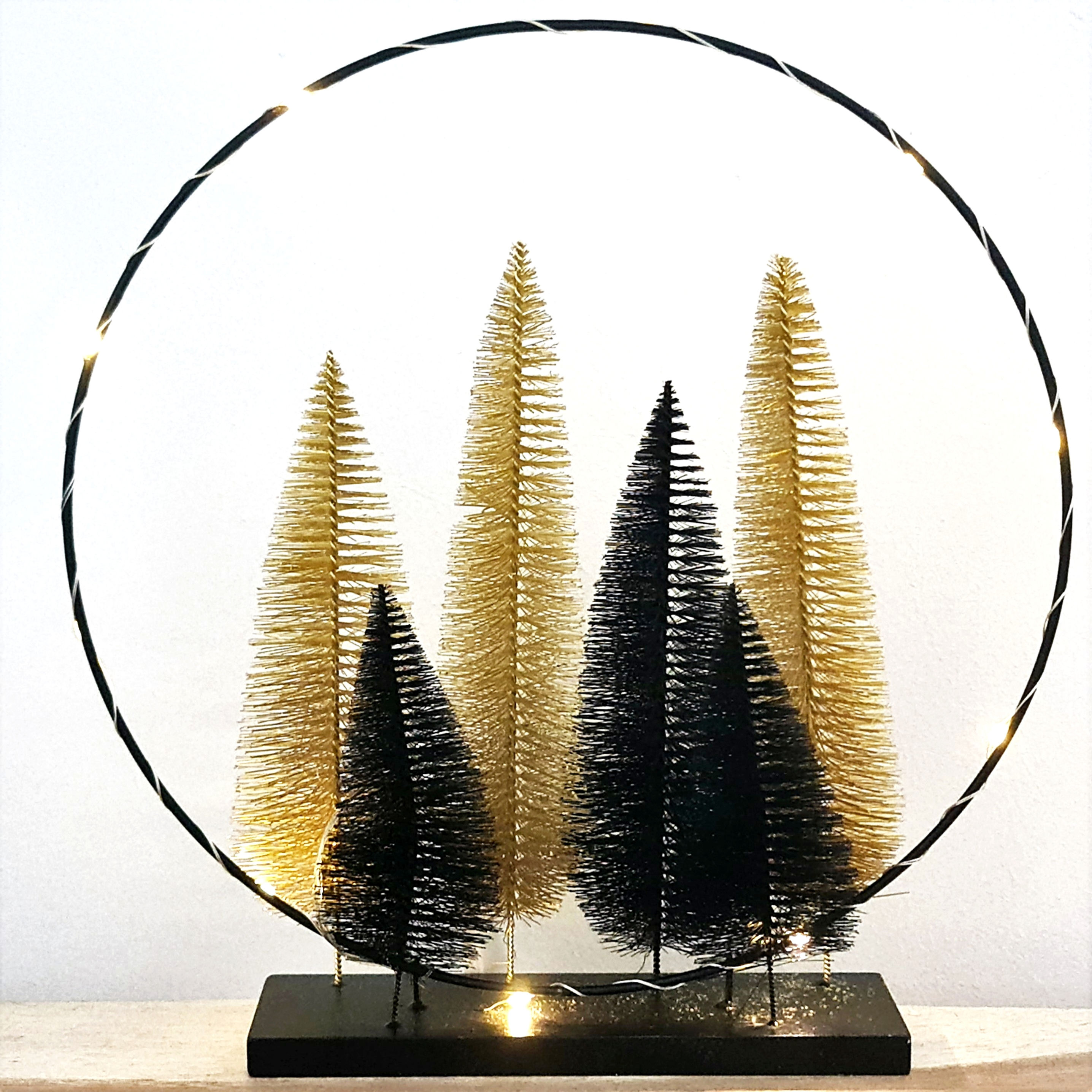 Sapins noirs & dorés sur support lumineux