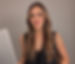 freepik__a-woman-with-long-wavy-brown-hair-is-seated-holdin__23585_edited.jpg