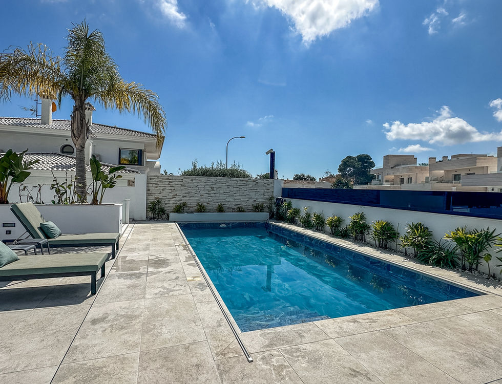 Modern outdoor lounge area with pool luxury villa Costa Blanca