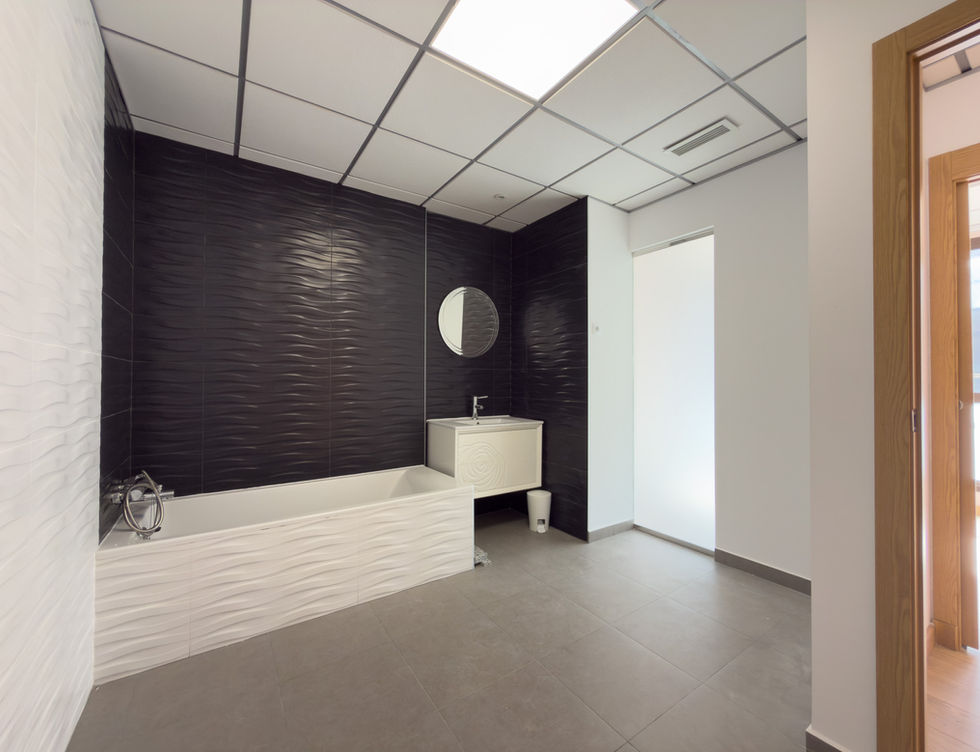 Premium commercial bathroom interior with modern black and white finishes