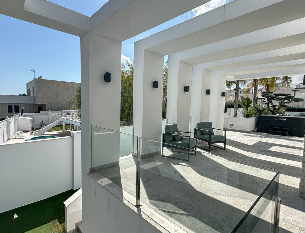 Premium villa exterior with terraces and garden views