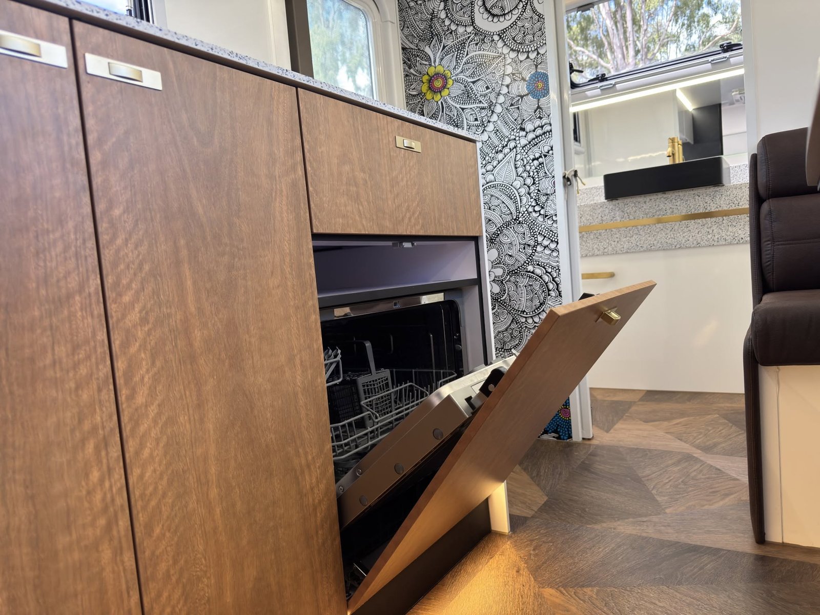 Fully integrated dishwasher behind a matching cabinet door